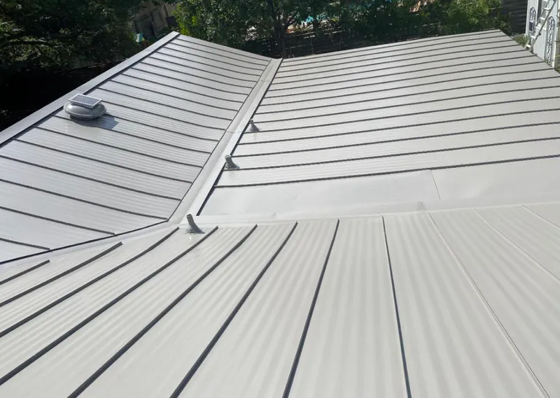 Solar attic fan installed on a metal roof for Roof Ventilation in Homosassa Springs
