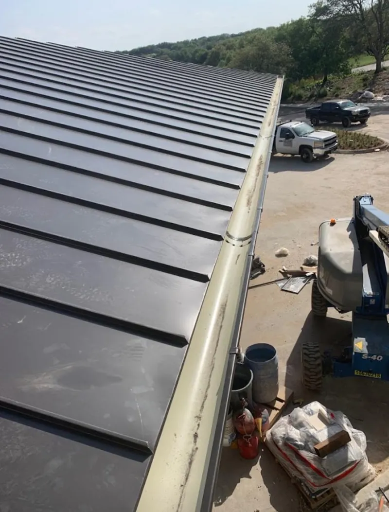 Standing seam panel and gutter detail on a metal roofing jobsite in Homosassa Springs